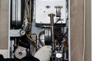 Technician Checking and Fixing Issue in Furnace System