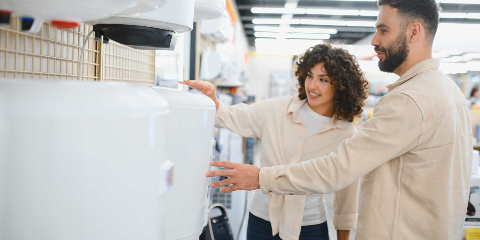 Couple Choosing Boiler System in an Electronic Shop