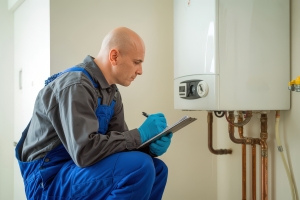 HVAC Professional Diagnosing Boiler Problems