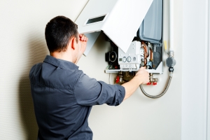 Technician Opening Boiler for Repair