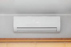 Modern White Ductless Mini Split AC Mounted on a Light Grey Wall